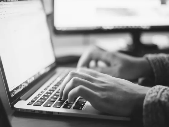 Man coding on laptop